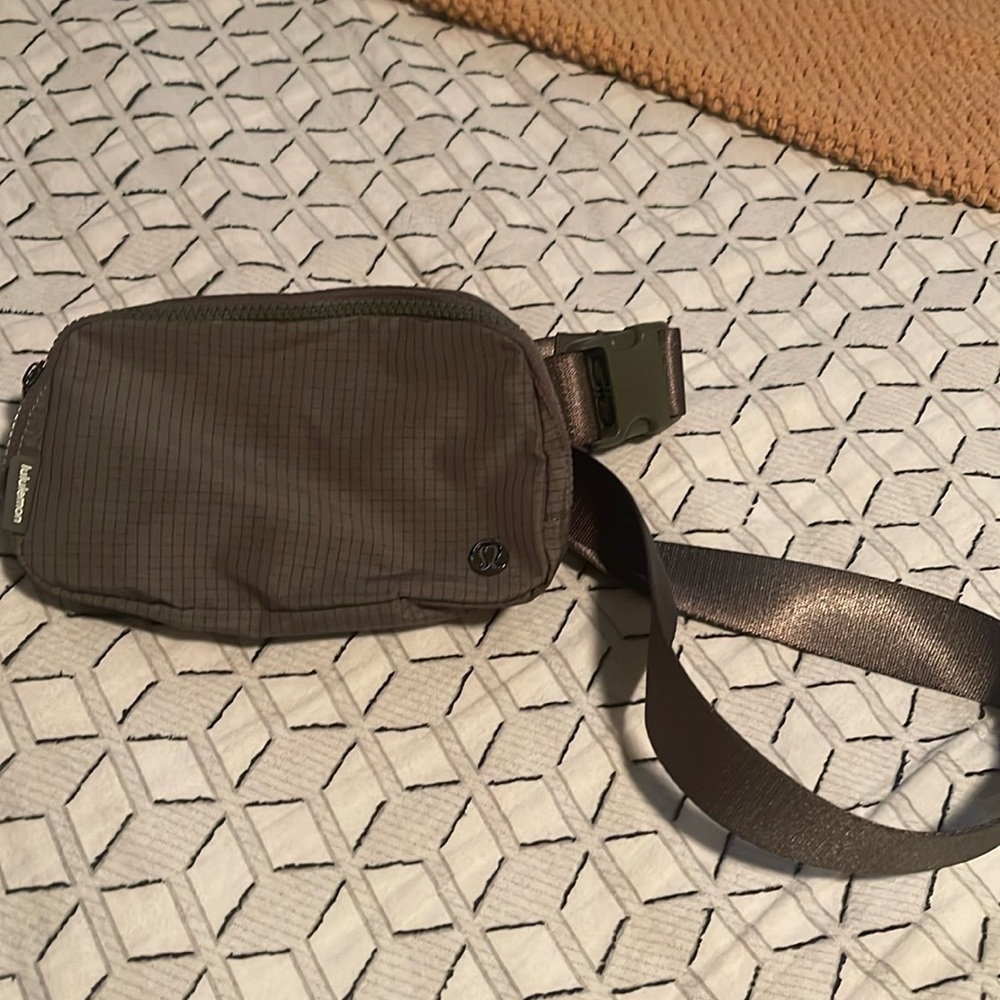 like new Lululemon belt bag. Grid pattern with gunmetal hardware